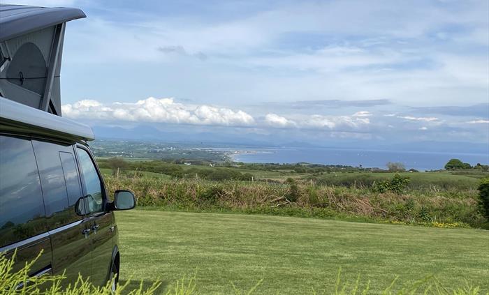 Stunning views from some of our grass pitches - looking onto Snowdonia and Cardigan Bay